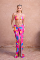 a woman in a garment and a pink skirt