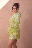 a woman in a green dress