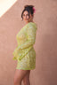 a woman in a green dress
