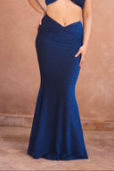a woman wearing a blue dress