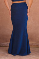 a woman wearing a blue dress