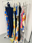 a rack of dresses on swingers