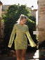 a woman in a green dress